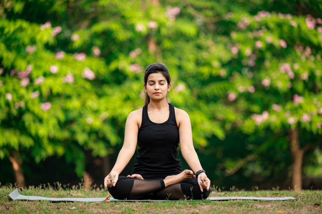 Woman practicing yoga for healthy living