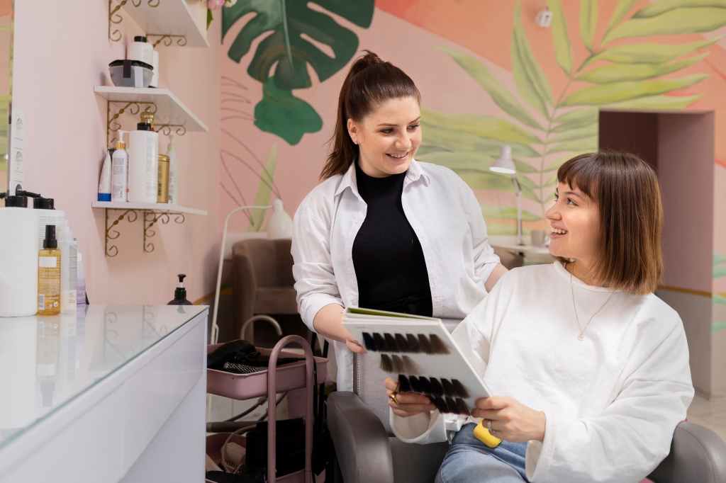 woman getting treatment at hairdresser shop