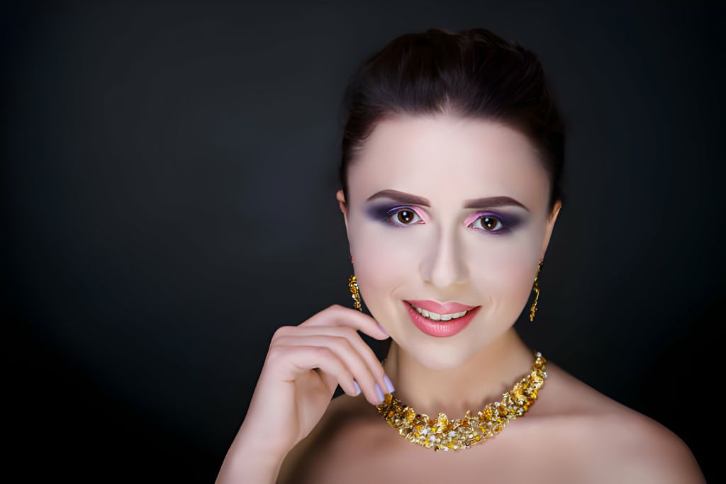 A Women Showcasing Gold Jewelry